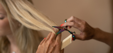 Woman with big bouncy TYME curls and highlights