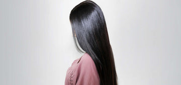 Woman with long black silky straight hair