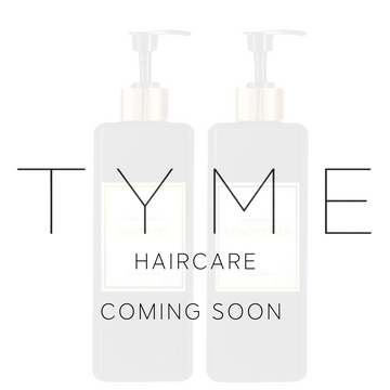 Bottle of shampoo and condiitoner side-by-side with the text "Tyme haircare coming soon"
