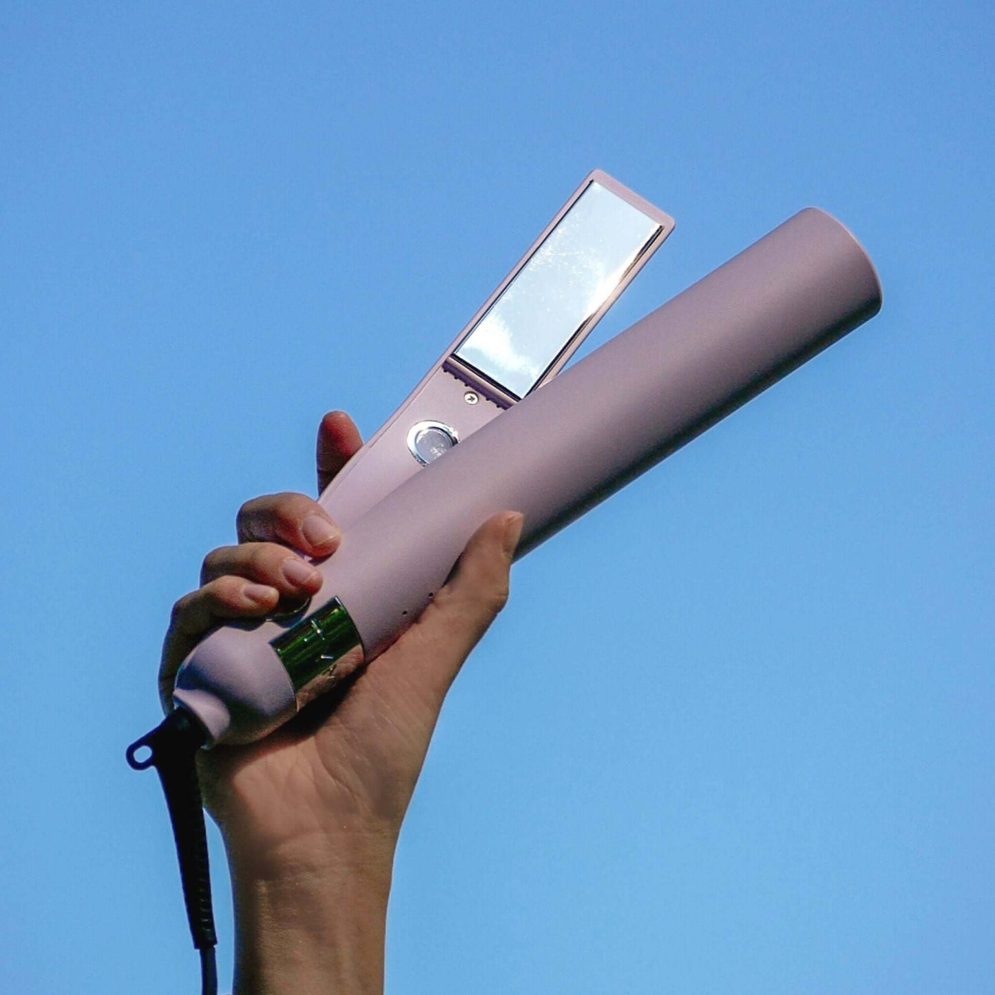 TYME Iron Pro: Aura being held in a woman's hand.