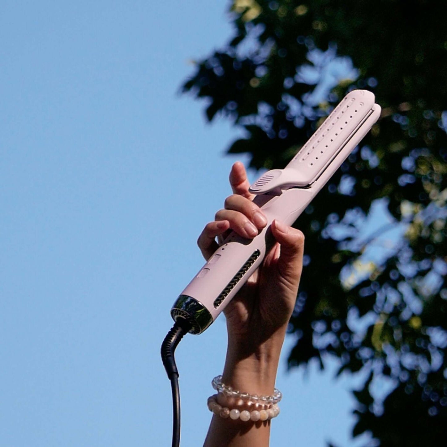 TYME Iron Air: Aura held in hand.