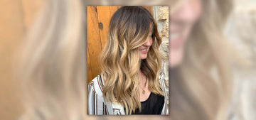 young lady with dirty blonde hair showing off her beach waves