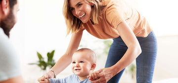 young mother with bob haircut walking her child to her father