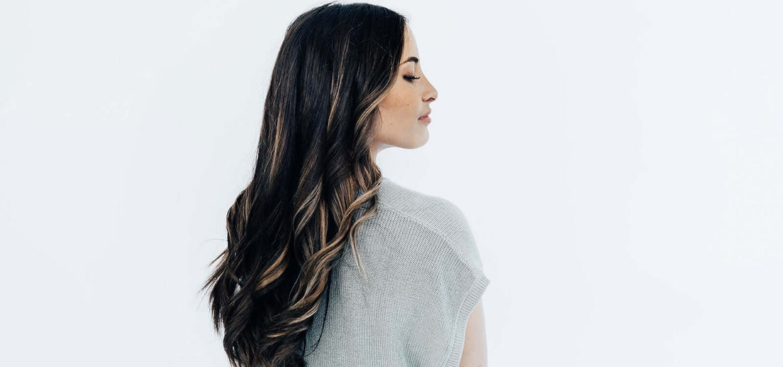 Woman with black hair/highlights and TYME curls