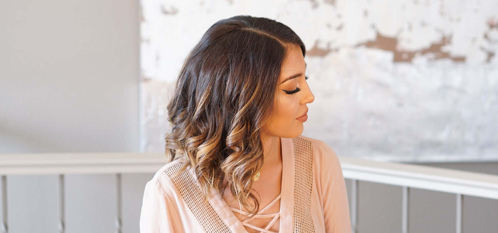 Woman with short brown hair and TYME curls 