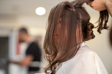Image of a girl getting her hair curled