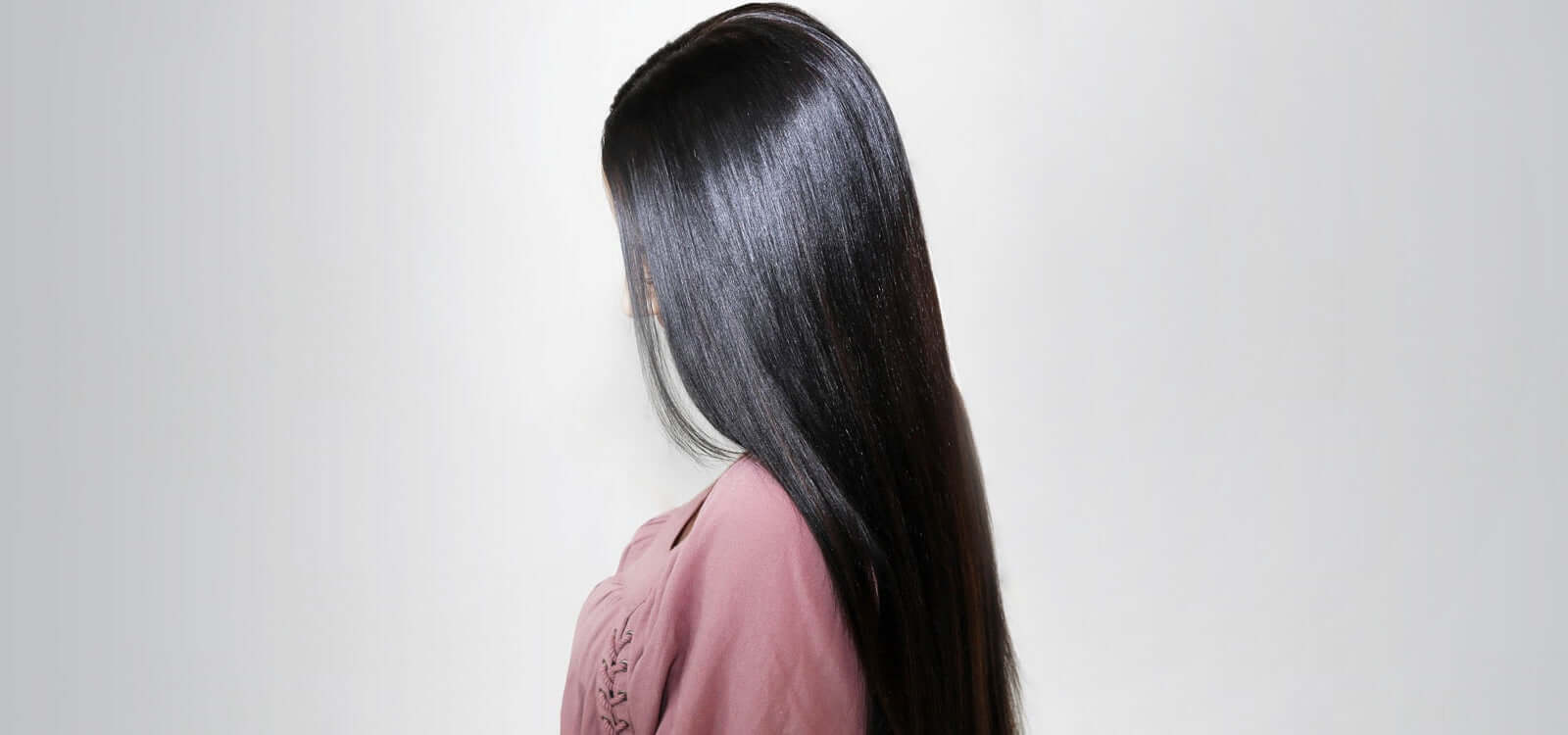 Woman with long black silky straight hair 
