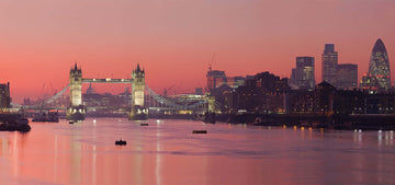 bridge over river and city of London at sunset time