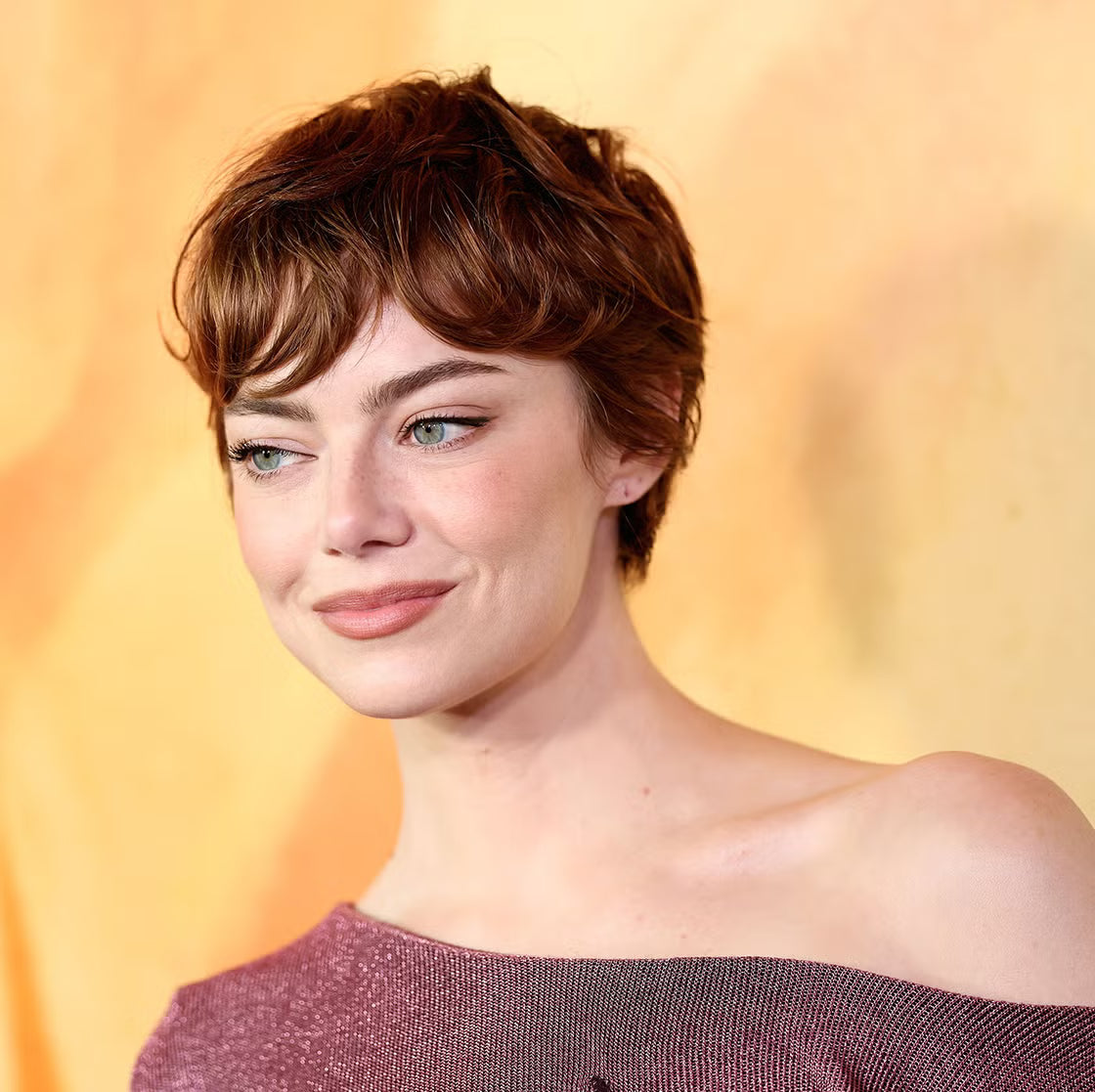An image that shows the Emma Stone pixie cut in a copper shade.