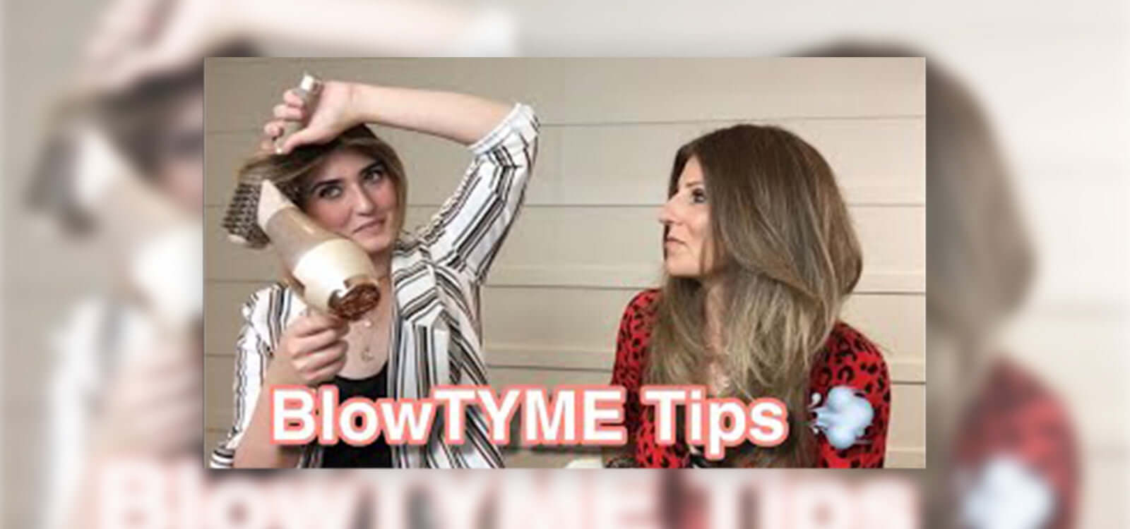 brunette using a round brush and blow dryer to style her hair