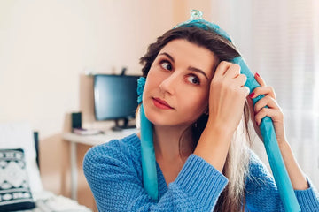 Woman rolling hair on heatless curling rods