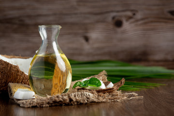 Image of a bottle of Coconut oil on a woodens surface.