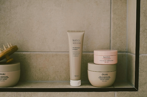 Image of hair products on a bathroom wall.