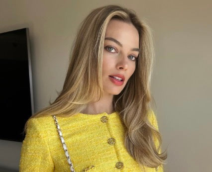  A close-up of Margot Robbie with a quiet luxury hairstyle.
