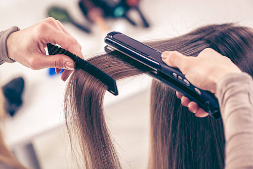 Image of hair being straightened.