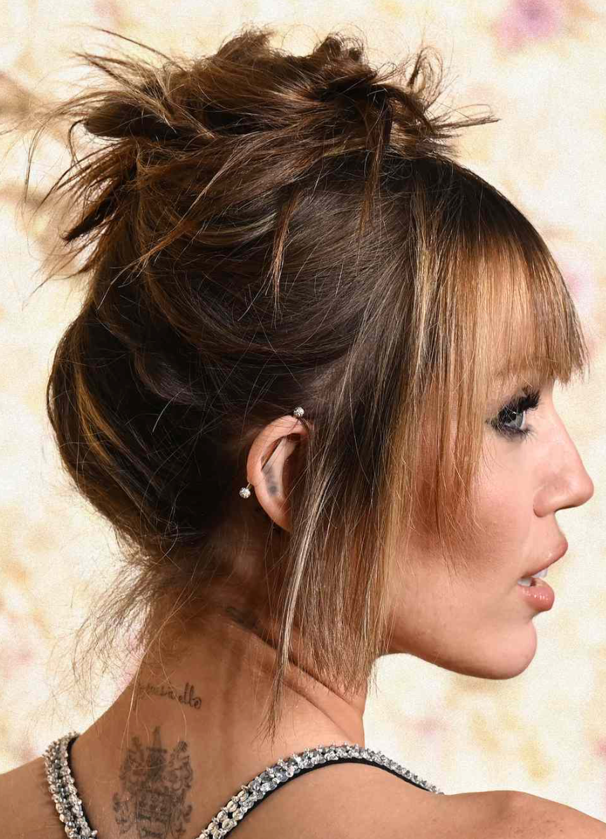 Image of Miley Cyrus with a messy bun.