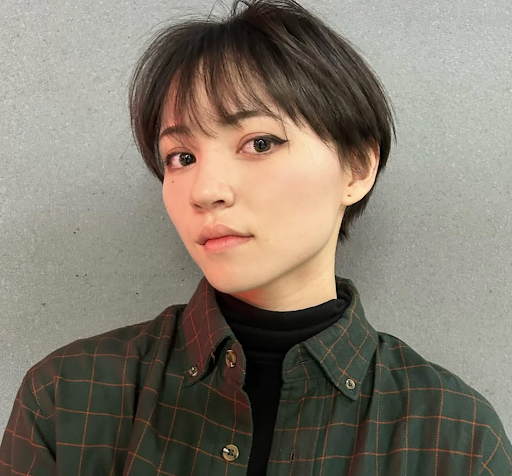 Image of a girl with a pixie cut.