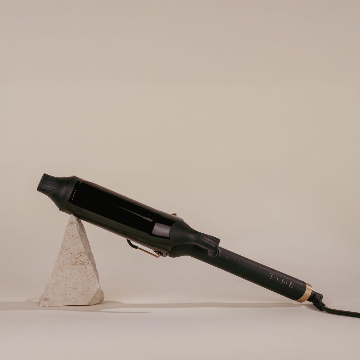 TYME 2 inch curling iron for volume, works on any hair type