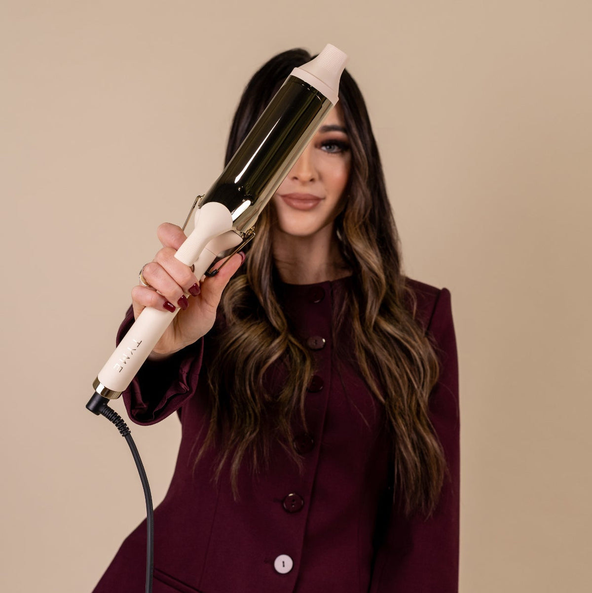 TYME 2 inch curling iron in Cashmere in use