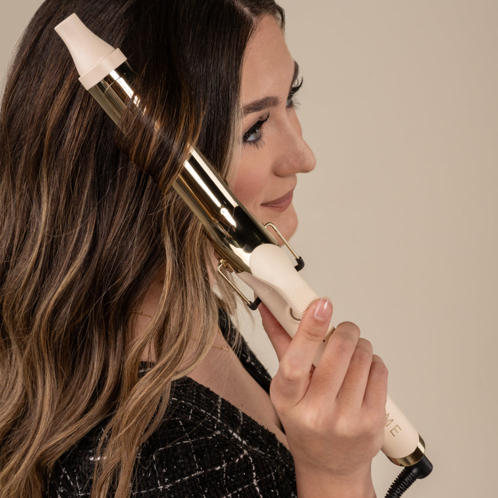 TYME 1.25 inch curling iron in Cashmere in use