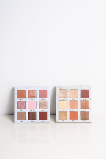 Lauren Ashtyn "eye candy" pressed powder eye shadow palette next to the "mood" eye shadow palette. 