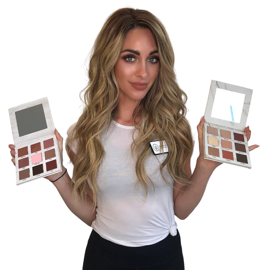 Woman holding an open palette of Lauren Ashtyn "eye candy" shadow on the left, and holding the "mood" palette on the right.