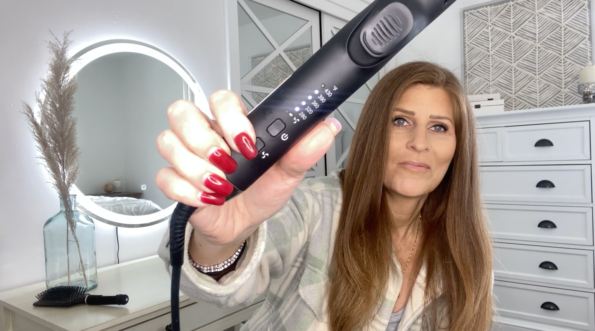 woman holding the tyme iron air