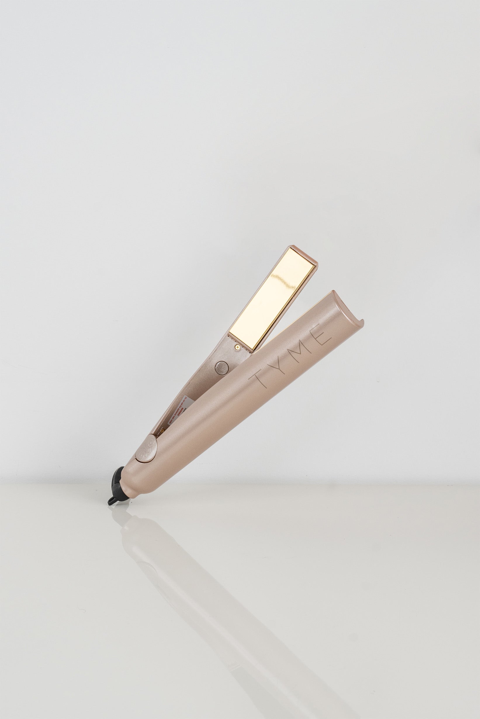 Original Tyme curling iron and flat iron in one, in a rose color