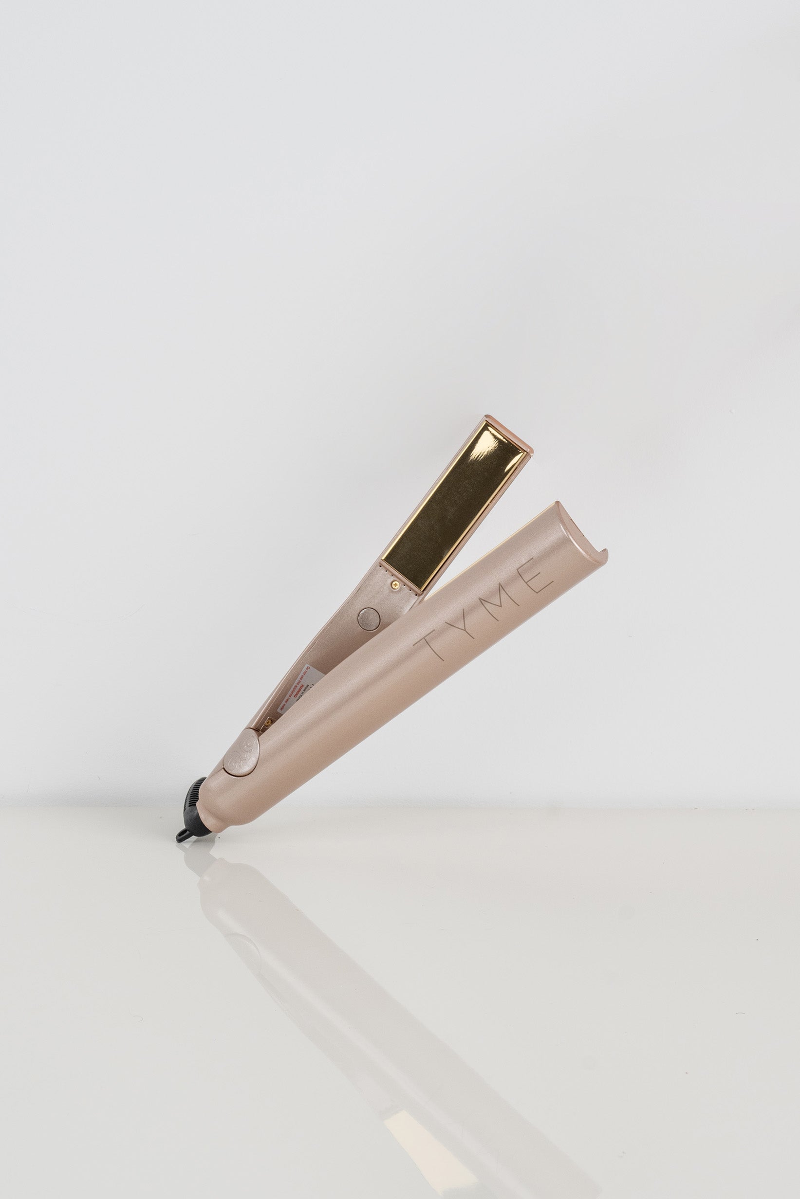 Original Tyme curling iron and flat iron in one, in a rose color