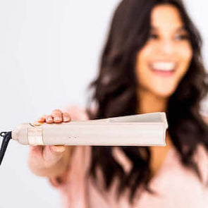 Woman showing off her TYME Iron Pro.