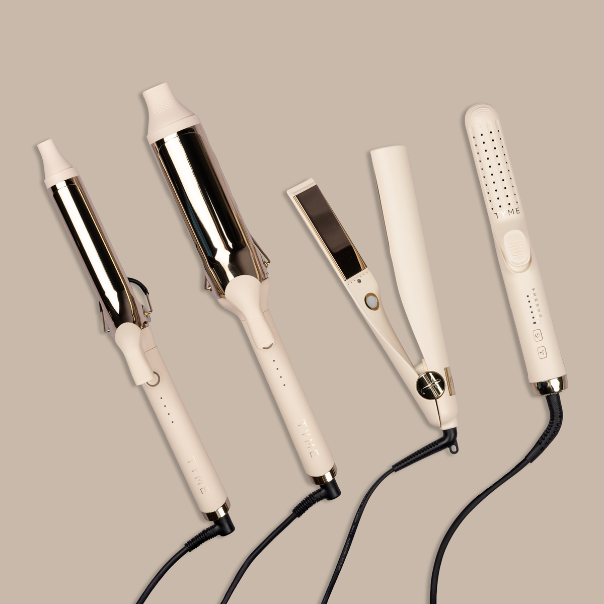 The full TYME Cashmere collection: 1.25 inch and 2 inch curling irons, the Iron Pro styling iron and the TYME Air blow dry brush, in cream