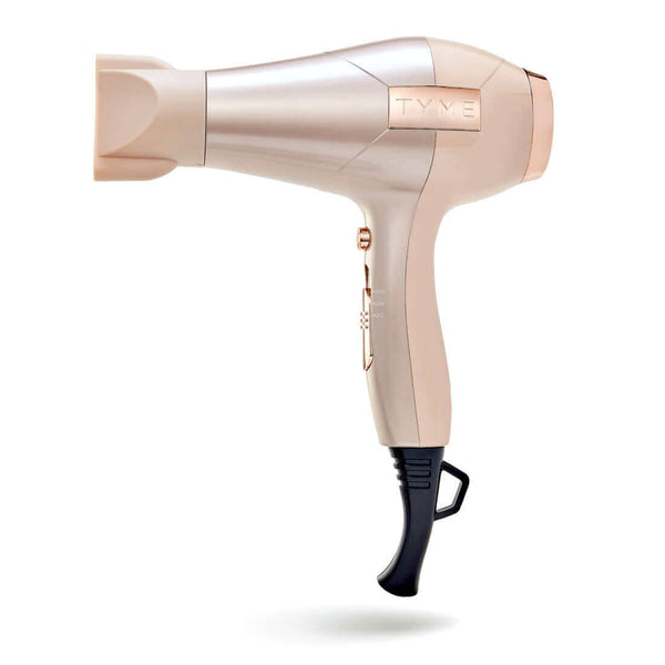 Side of pale taupe and rose gold TYME BlowTYME Hair Dryer with included concentrator attached and handle loop at the base.