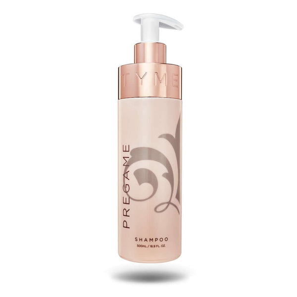 TYME PREGAME Shampoo in beige 16.9 ounce beige bottle with taupe fleur de lis logo and rose gold pump nozzle.
